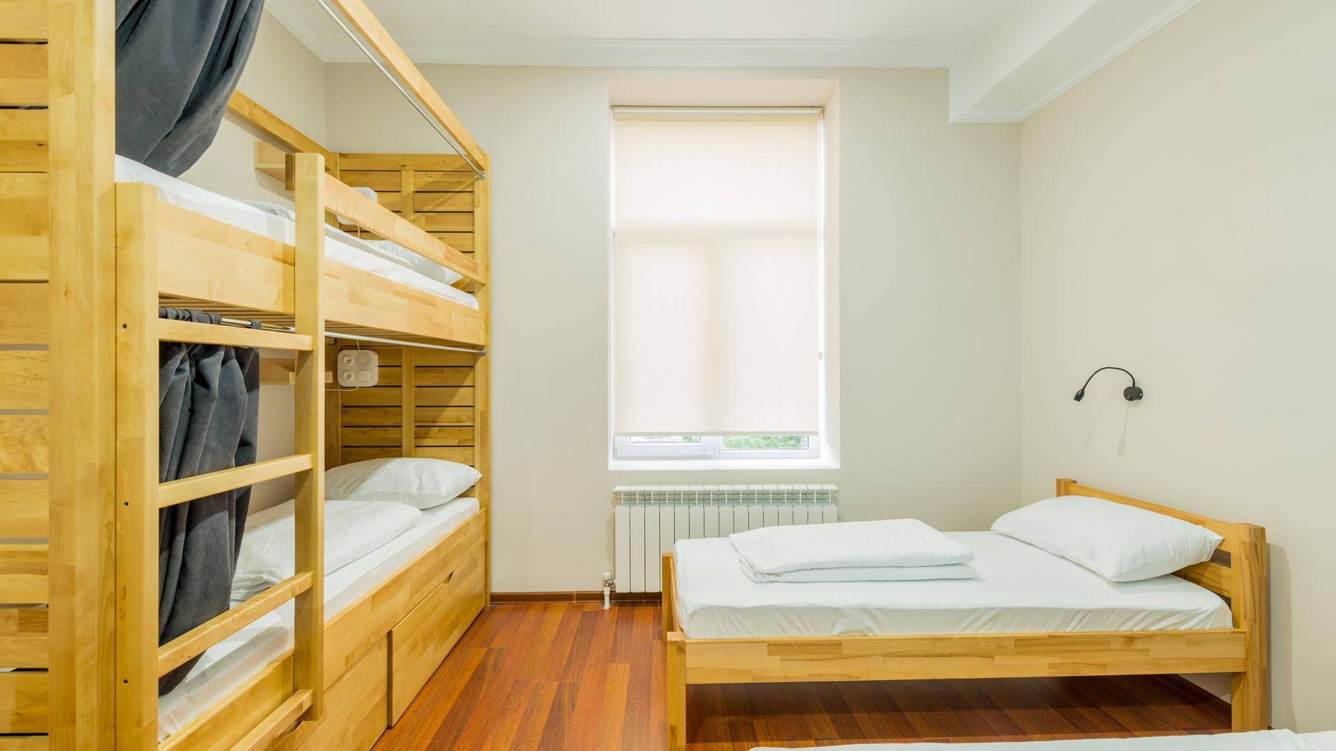 Hostel dormitory beds arranged in room