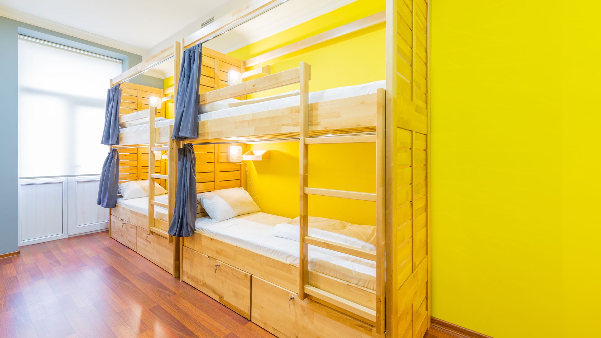 Hostel dormitory beds arranged in room